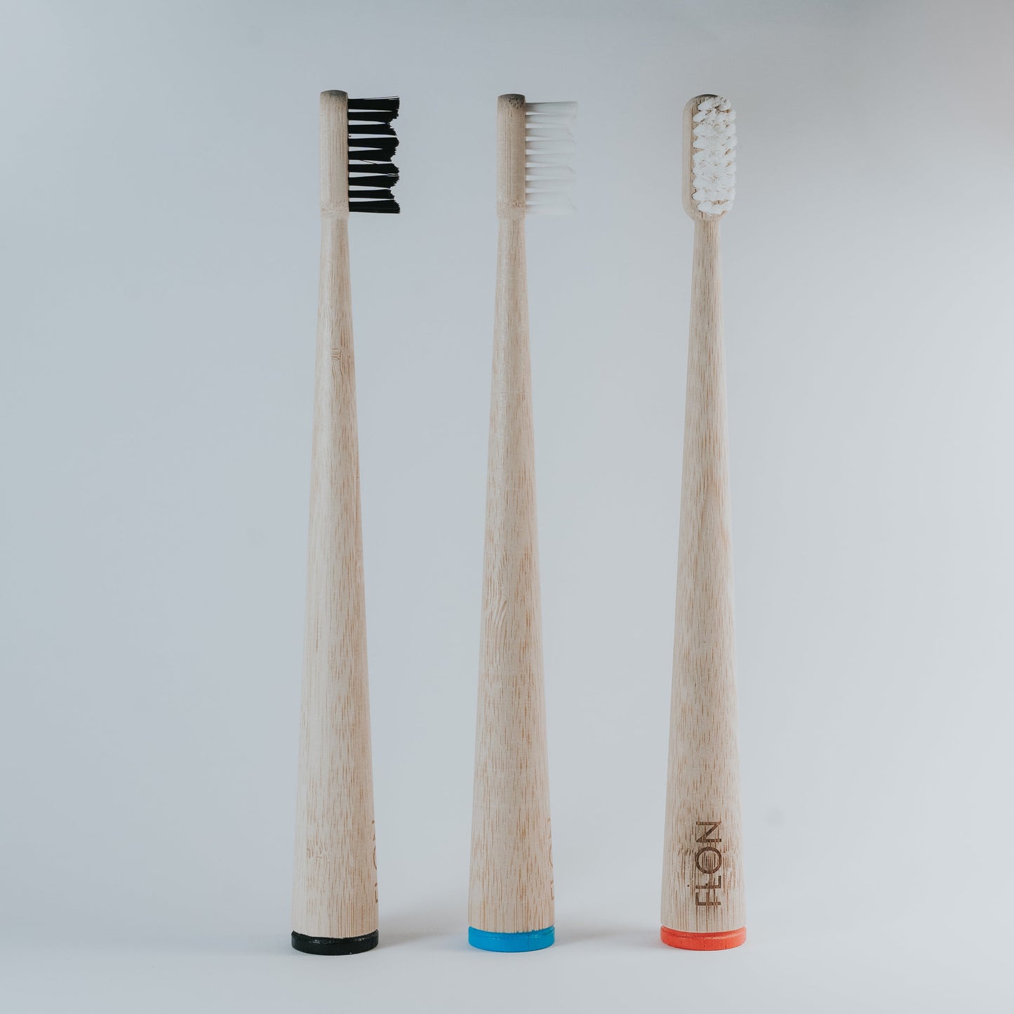 Adult bamboo toothbrushes with BPA-free bristles in assorted colours, vegan and plastic-free.
