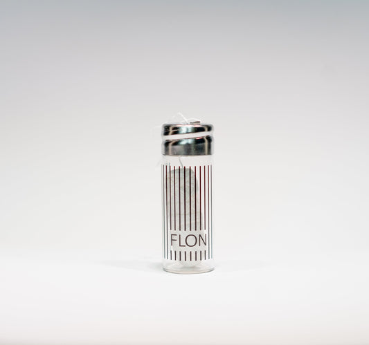 Refillable glass dispenser with natural silk dental floss, zero-waste and biodegradable.
