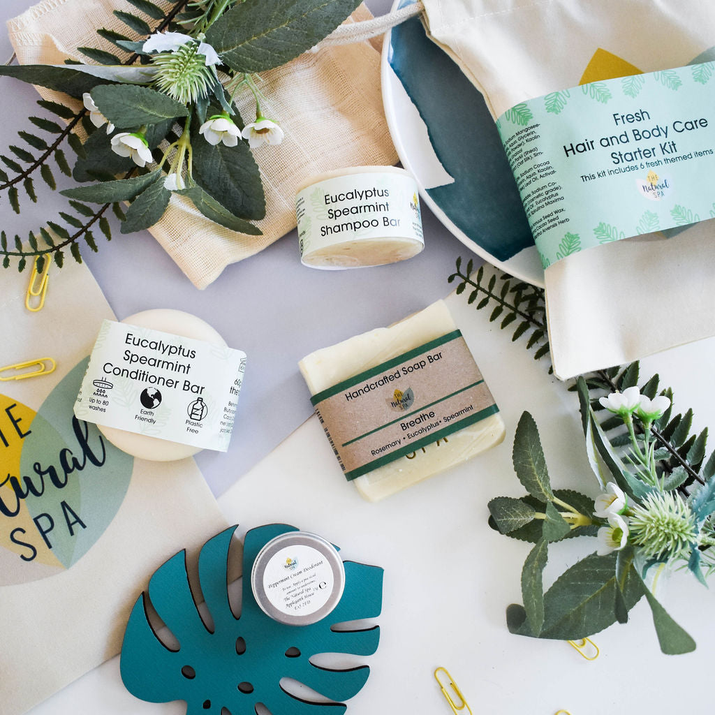 Eco-friendly Fresh hair and body starter kit with solid shampoo, conditioner and soap bars in a reusable bag.