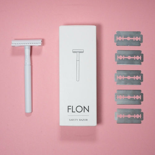Reusable safety razor kit with 5 stainless steel blades and eco-friendly brass handle.