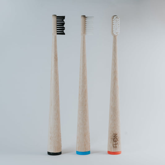 Adult bamboo toothbrushes with BPA-free bristles in assorted colours, vegan and plastic-free.