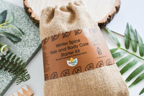 Plastic-free Winter Spice hair and body care kit with handmade solid bars and sustainable packaging.