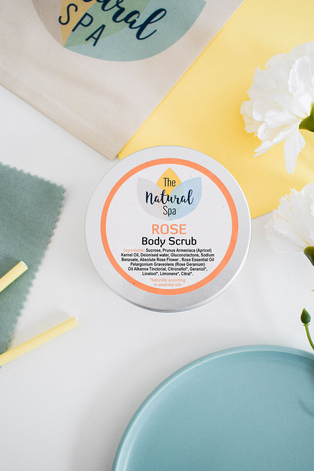 Rose sugar scrub showing soft pink texture, floral ingredients and natural skincare.